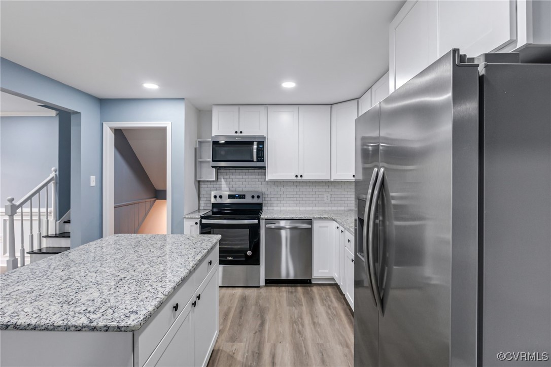 9232 Groomfield Road Chesterfield, VA 23236 - Photo 10 of 50 a kitchen with stainless steel appliances granite countertop a refrigerator a stove and a sink
