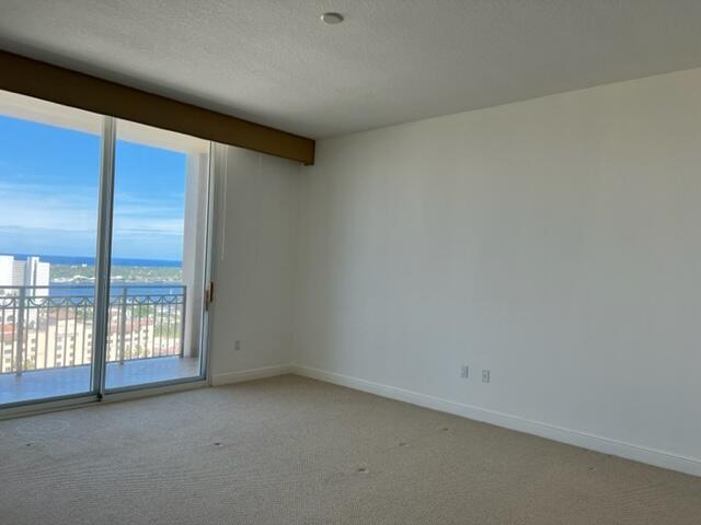 550 Okeechobee Boulevard, Unit MPH02 West Palm Beach, FL 33401 - Photo 12 of 32 an empty room with windows
