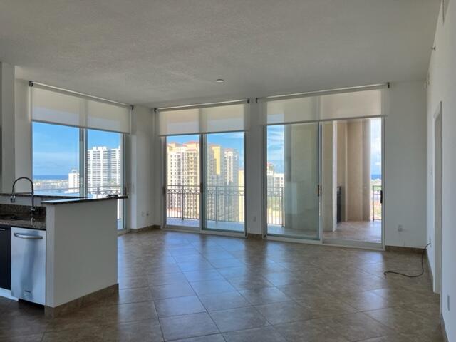 550 Okeechobee Boulevard, Unit MPH02 West Palm Beach, FL 33401 - Photo 17 of 32 a view of an empty room with wooden floor and a window