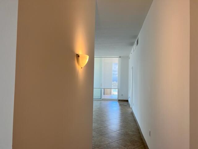 550 Okeechobee Boulevard, Unit MPH02 West Palm Beach, FL 33401 - Photo 23 of 32 a view of a room with wooden floor