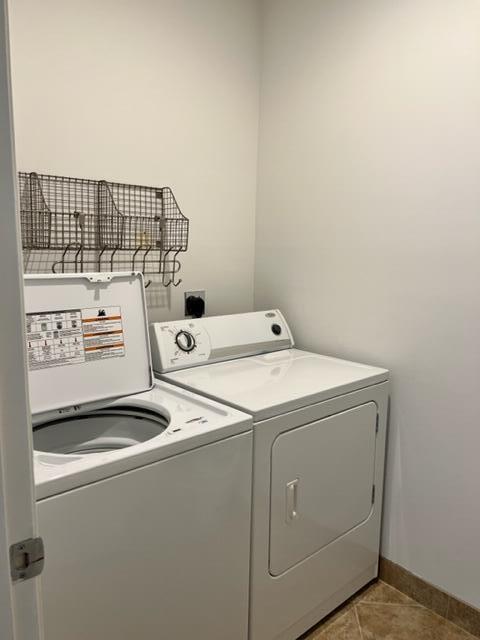 550 Okeechobee Boulevard, Unit MPH02 West Palm Beach, FL 33401 - Photo 29 of 32 a utility room with dryer and washer