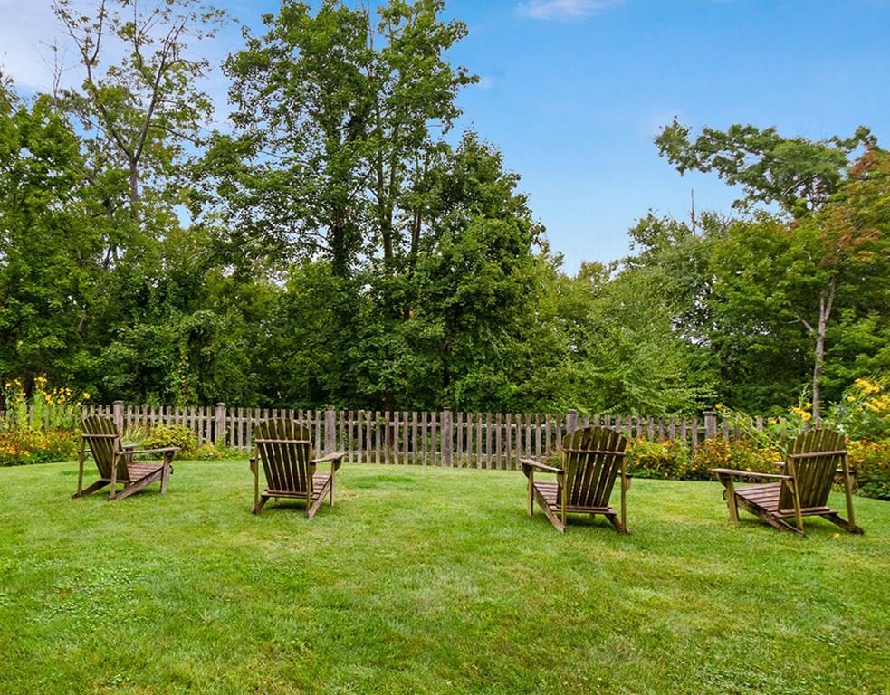 14 Hilliard Road Lincoln, MA 01773 - Photo 11 of 31 a view of a chair and table in the garden
