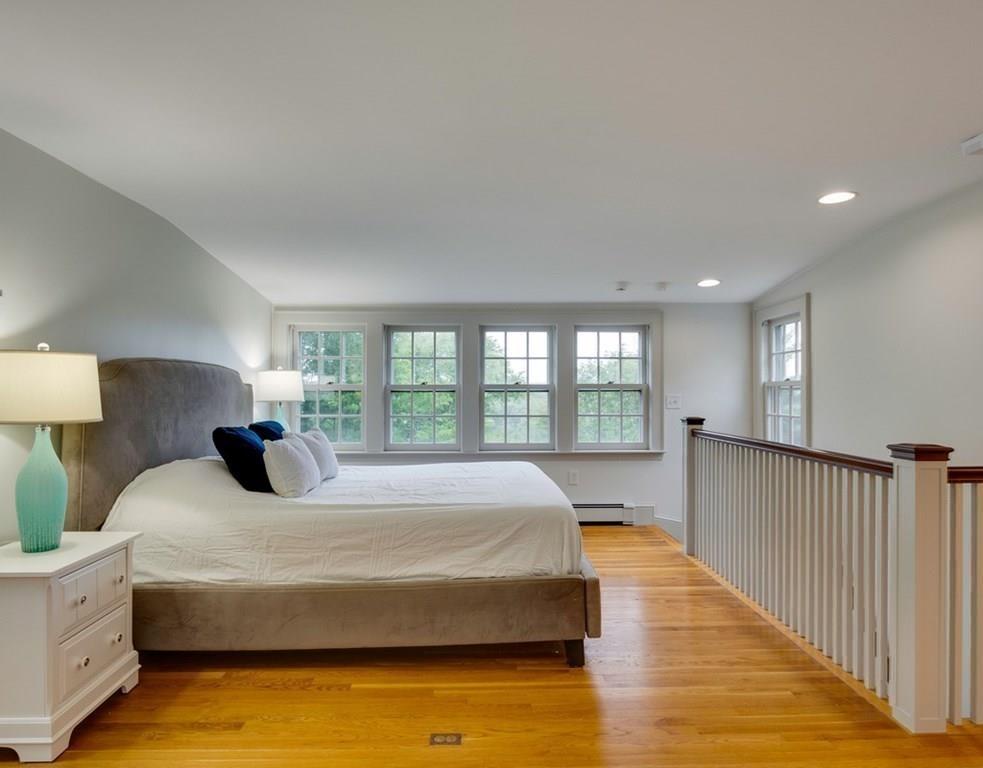14 Hilliard Road Lincoln, MA 01773 - Photo 12 of 31 a bedroom with a large bed and a large window