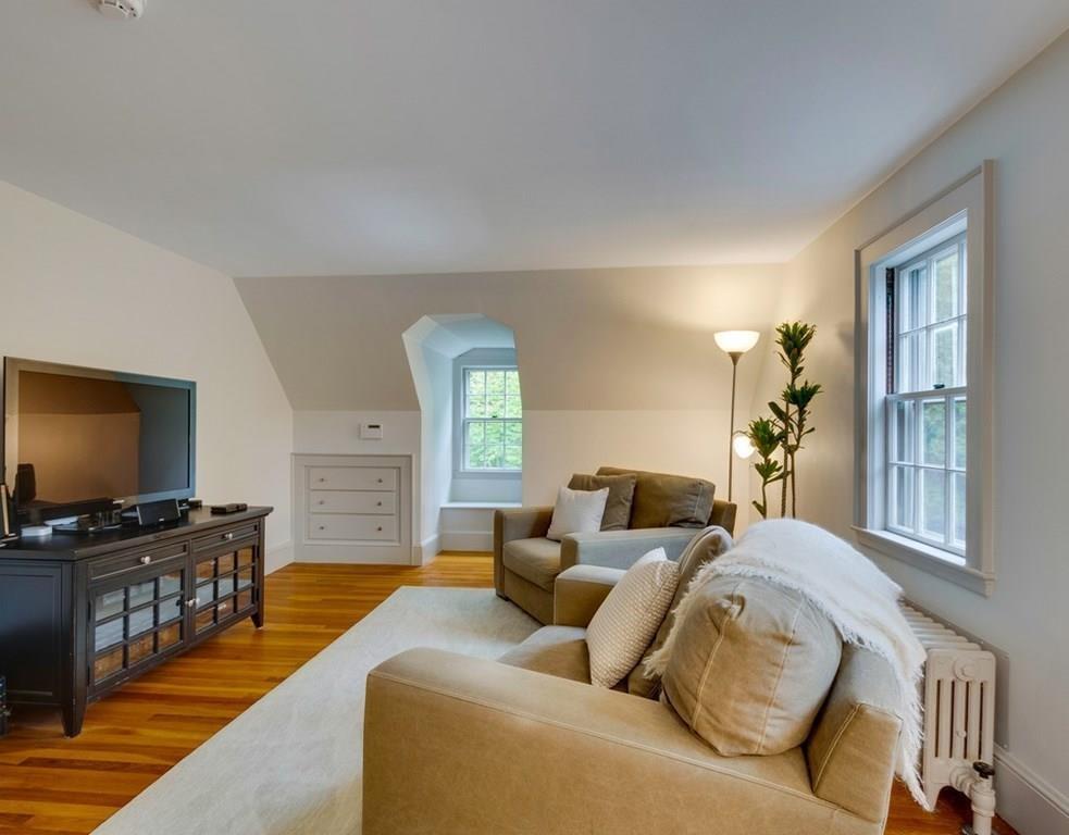 14 Hilliard Road Lincoln, MA 01773 - Photo 18 of 31 a living room with furniture and a flat screen tv