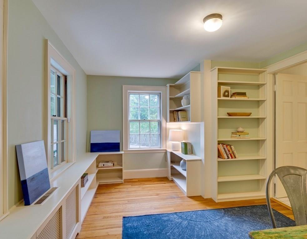 14 Hilliard Road Lincoln, MA 01773 - Photo 19 of 31 a living room with furniture and a book shelf