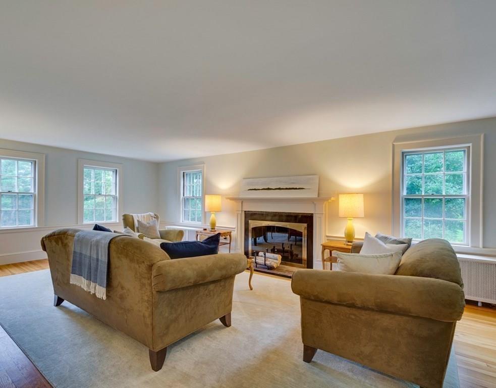 14 Hilliard Road Lincoln, MA 01773 - Photo 3 of 31 a living room with furniture and a fireplace