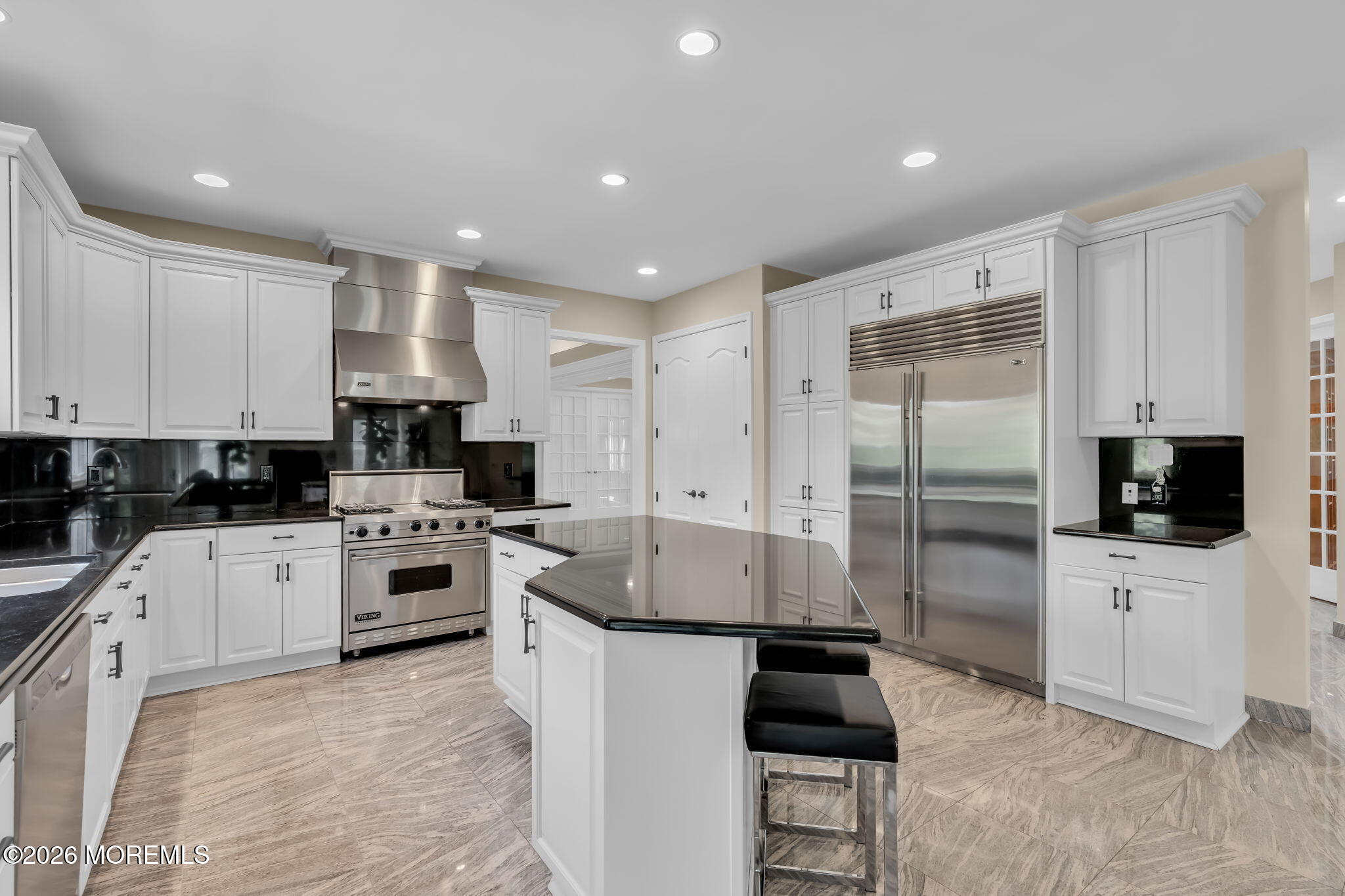14 Diamond Hill Road Marlboro, NJ 07746 - Photo 18 of 79 a kitchen with white cabinets and stainless steel appliances
