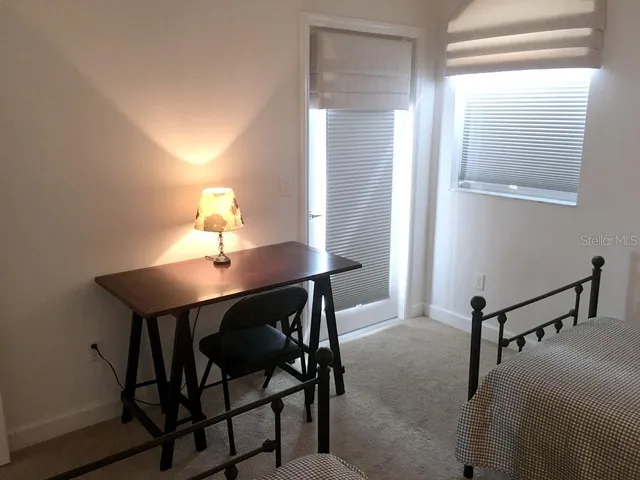 a view of a workspace with furniture