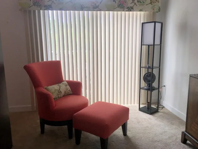 a livingroom with furniture and a window