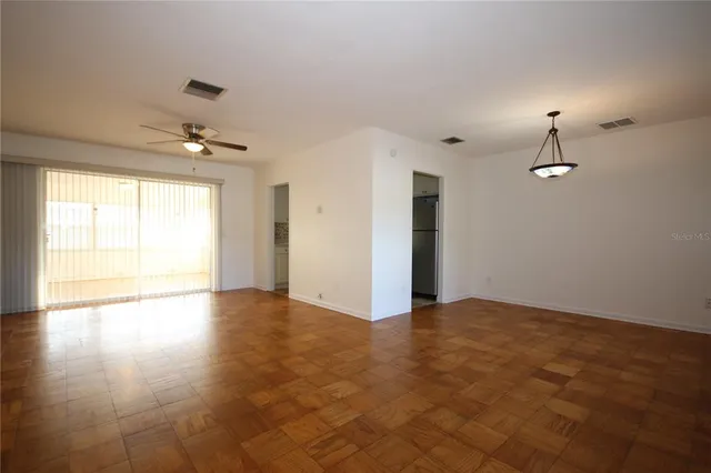 a view of an empty room with a window