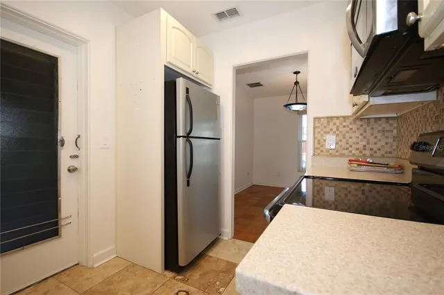 a bedroom with a bed and a stove