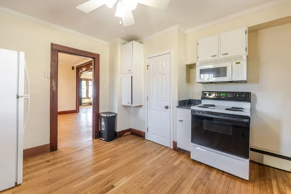 a kitchen with a stove and a refrigerator