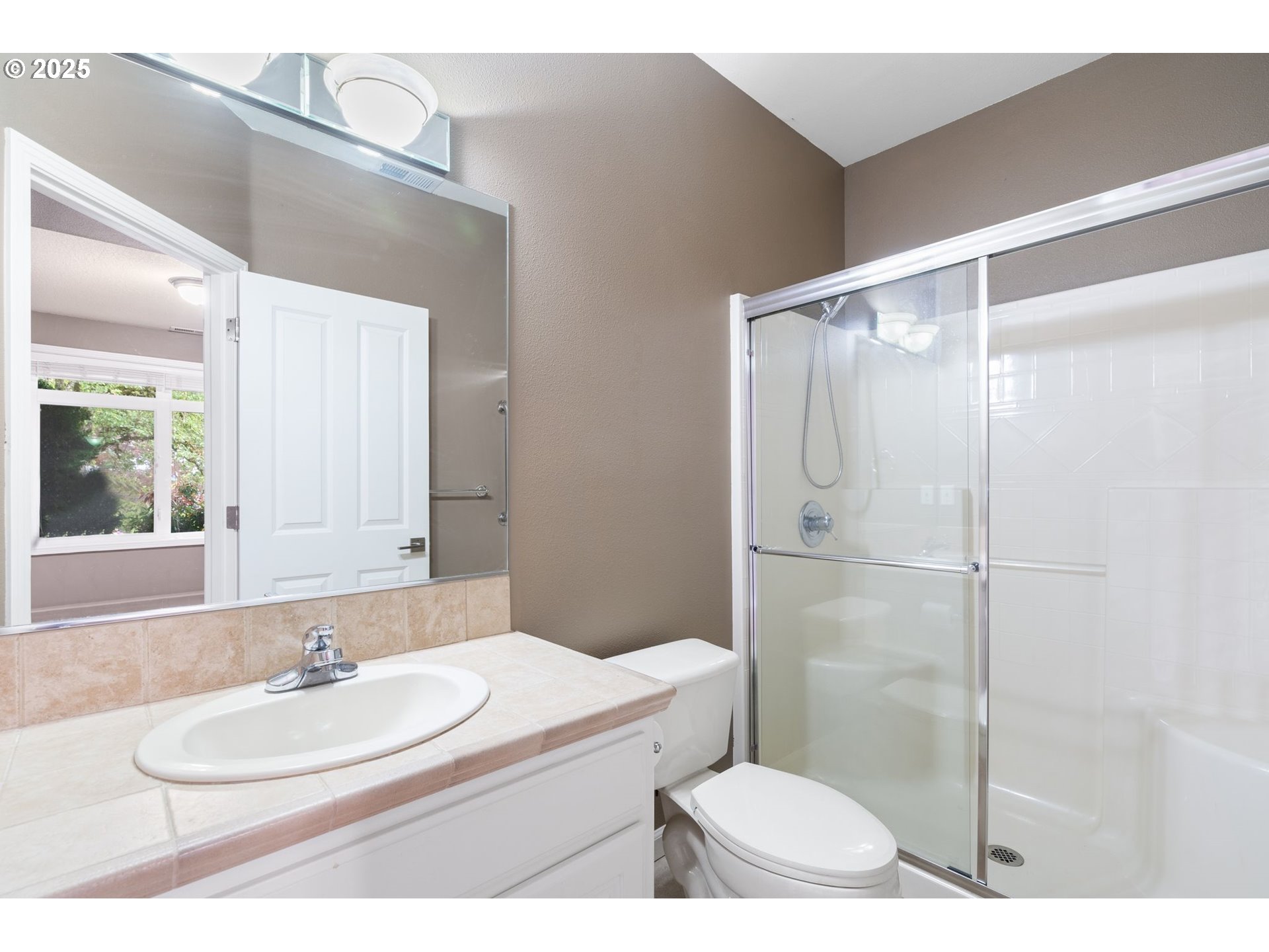 1925 Hall Street West Linn, OR 97068 - Photo 18 of 28 a bathroom with a sink a toilet a mirror and shower