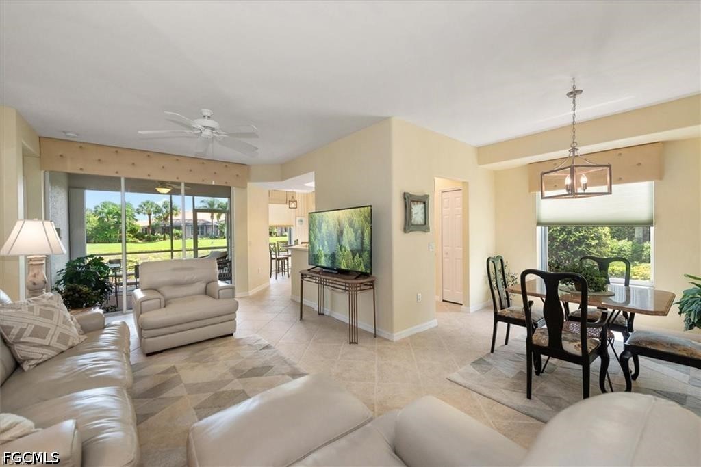 11033 Mill Creek Way, Unit 202 Fort Myers, FL 33913 - Photo 3 of 15 a living room with furniture and a flat screen tv