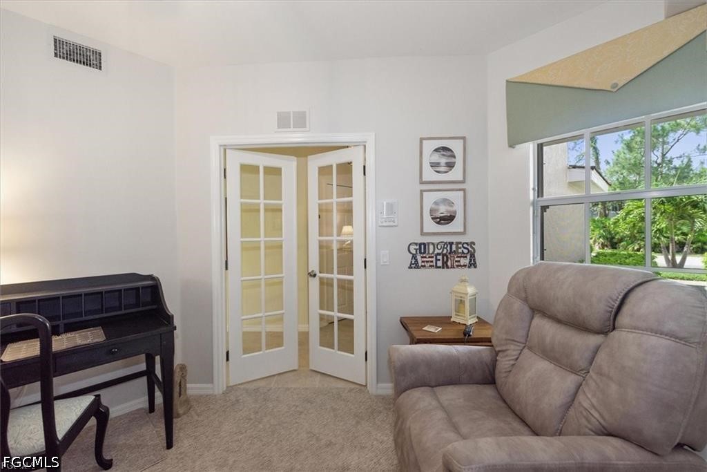 11033 Mill Creek Way, Unit 202 Fort Myers, FL 33913 - Photo 7 of 15 a living room with furniture and a window