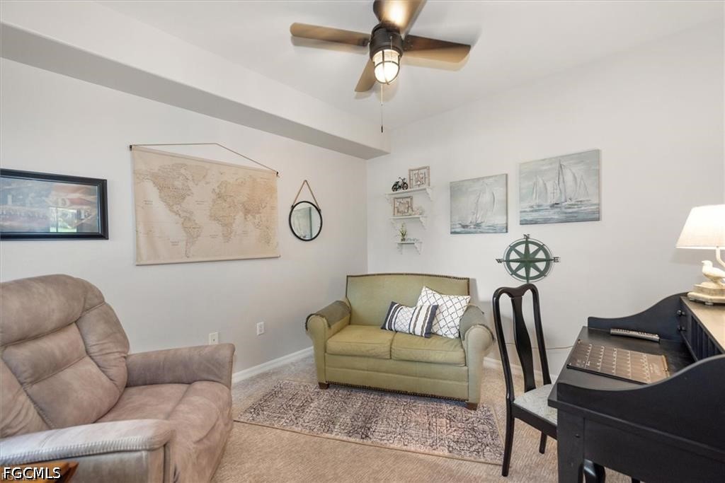 11033 Mill Creek Way, Unit 202 Fort Myers, FL 33913 - Photo 8 of 15 a living room with furniture and a couch