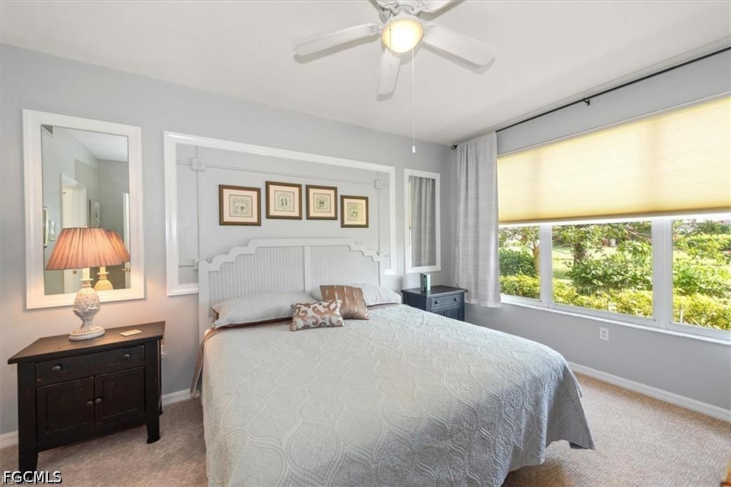 11033 Mill Creek Way, Unit 202 Fort Myers, FL 33913 - Photo 9 of 15 a bedroom with a bed and a window