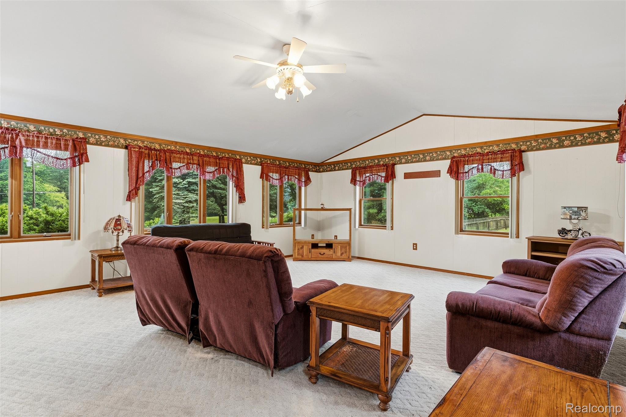 6109 North State Road Davison, MI 48423 - Photo 26 of 39 Spacious living area featuring light-colored carpeting and numerous windows