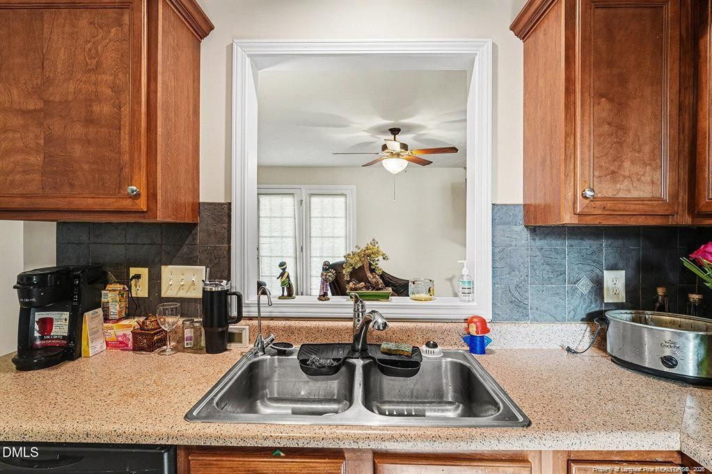 831 Raspberry Road Stedman, NC 28391 - Photo 14 of 35 a kitchen with granite countertop a sink and a stove top oven