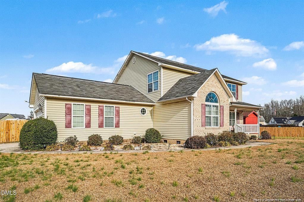 831 Raspberry Road Stedman, NC 28391 - Photo 2 of 35 a front view of a house with a yard