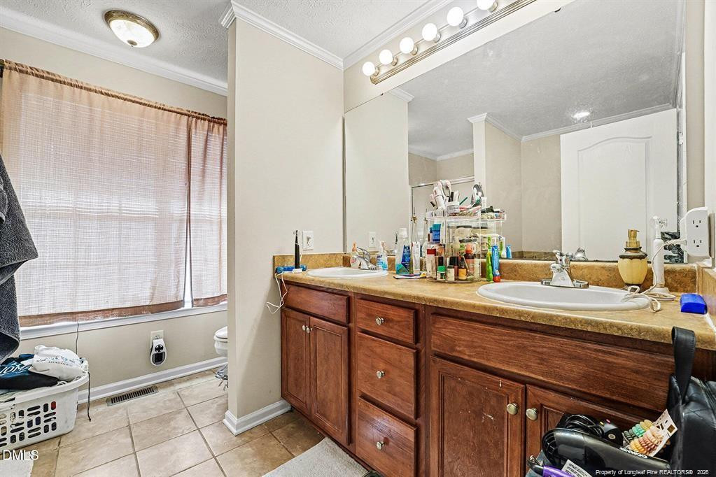 831 Raspberry Road Stedman, NC 28391 - Photo 21 of 35 a room with sink and mirror