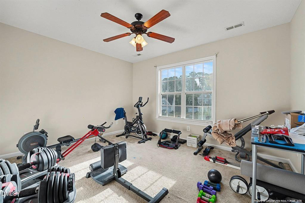 831 Raspberry Road Stedman, NC 28391 - Photo 27 of 35 a view of a workspace with furniture gym equipment