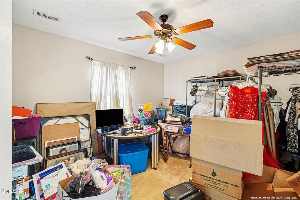 831 Raspberry Road Stedman, NC 28391 - Photo 29 of 35 a workspace with furniture and a window