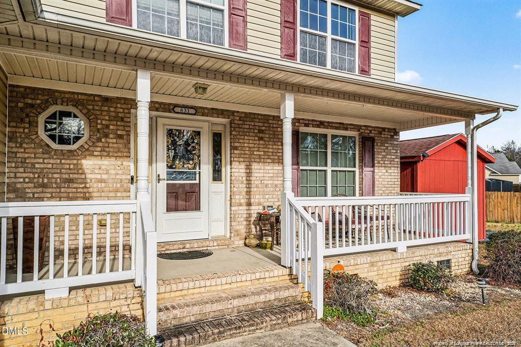 831 Raspberry Road Stedman, NC 28391 - Photo 3 of 35 front view of a house with a porch