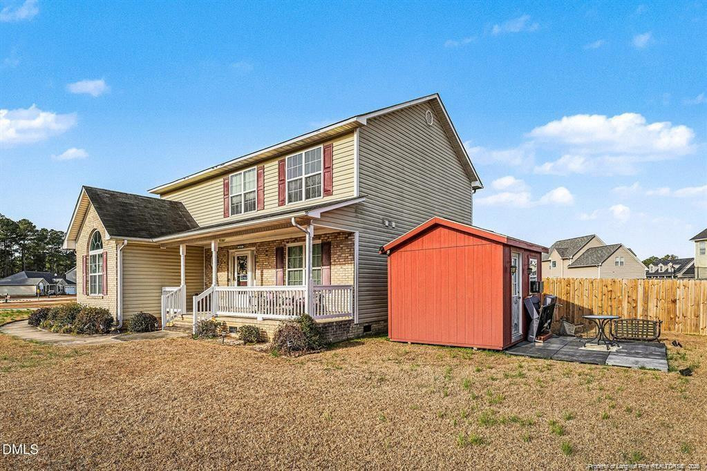 831 Raspberry Road Stedman, NC 28391 - Photo 31 of 35 a backyard of a house with basket ball court and outdoor seating