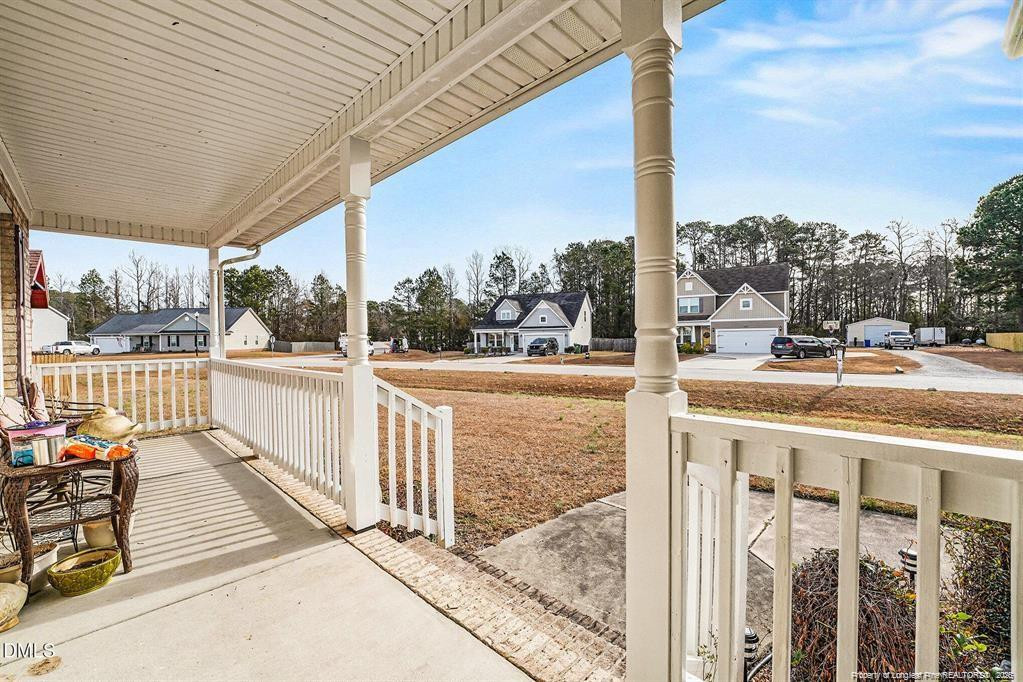 831 Raspberry Road Stedman, NC 28391 - Photo 4 of 35 a view of a balcony and car parked