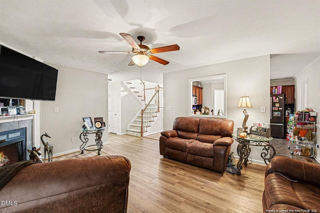 831 Raspberry Road Stedman, NC 28391 - Photo 7 of 35 a living room with furniture and a flat screen tv
