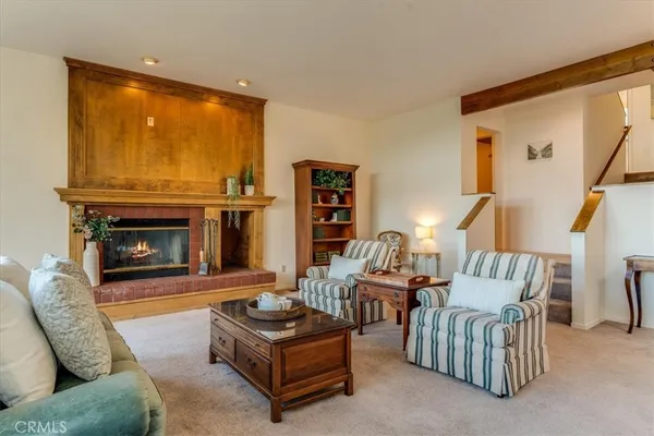 a view of a green yard with large trees