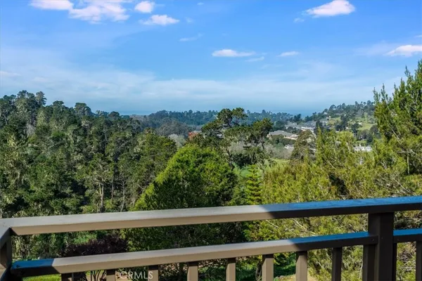 a view of a dining room with furniture and a window