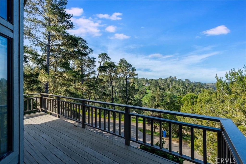 3171 Rogers Road Cambria, CA 93428 - Photo 20 of 73 a view of a balcony with wooden floor and fence