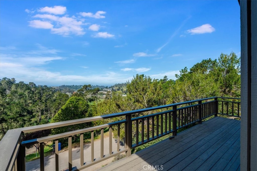 3171 Rogers Road Cambria, CA 93428 - Photo 21 of 73 a view of a balcony with wooden floor and fence