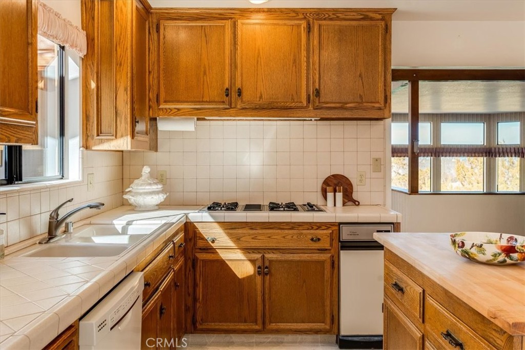 3171 Rogers Road Cambria, CA 93428 - Photo 24 of 73 a kitchen with a sink and cabinets
