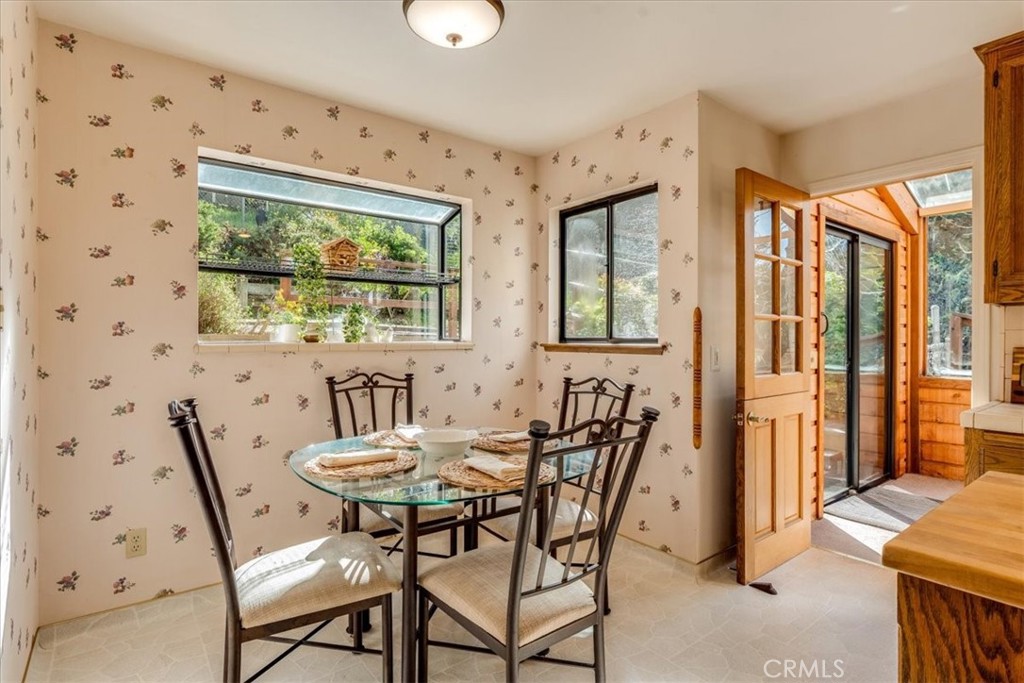 3171 Rogers Road Cambria, CA 93428 - Photo 27 of 73 a view of a dining room with furniture and a window