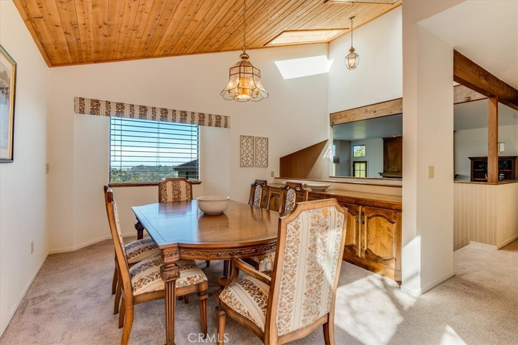 3171 Rogers Road Cambria, CA 93428 - Photo 33 of 73 a view of a dining room with furniture and a chandelier