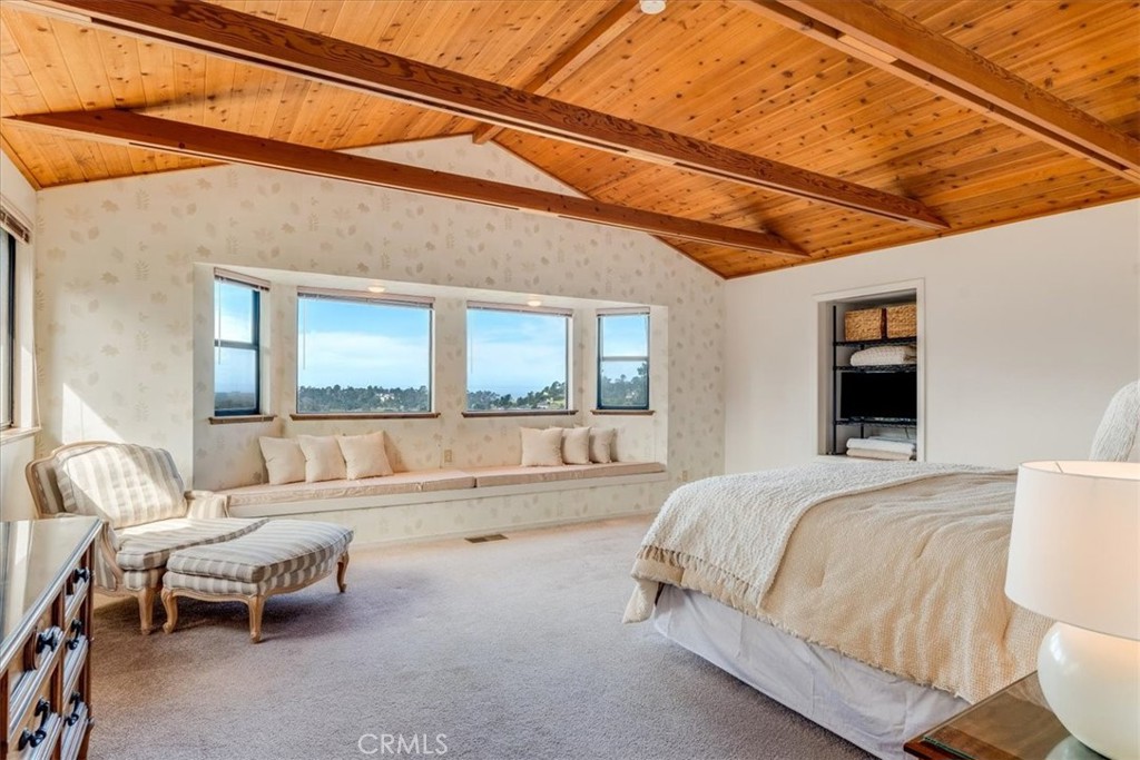 3171 Rogers Road Cambria, CA 93428 - Photo 35 of 73 a spacious bedroom with a bed and a window