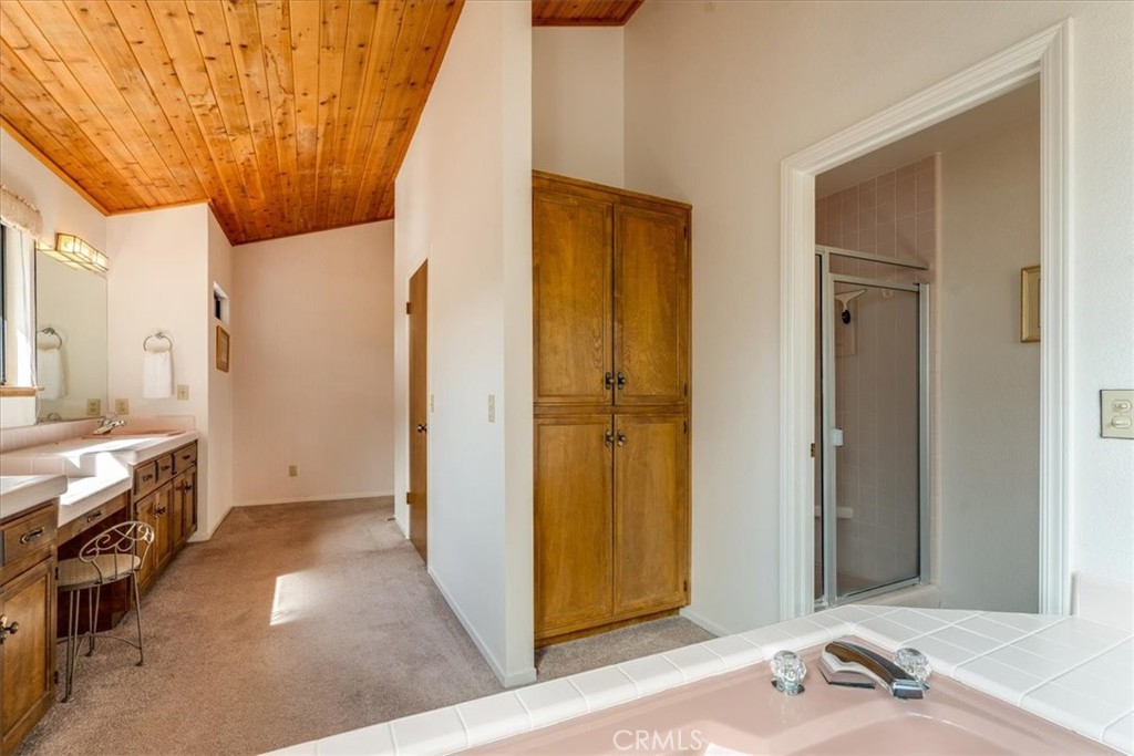 3171 Rogers Road Cambria, CA 93428 - Photo 41 of 73 a view of a bathroom with a sink and mirror