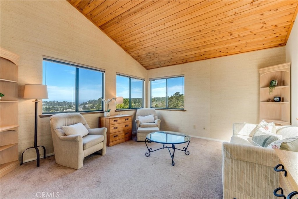 3171 Rogers Road Cambria, CA 93428 - Photo 42 of 73 a living room with furniture and a floor to ceiling window