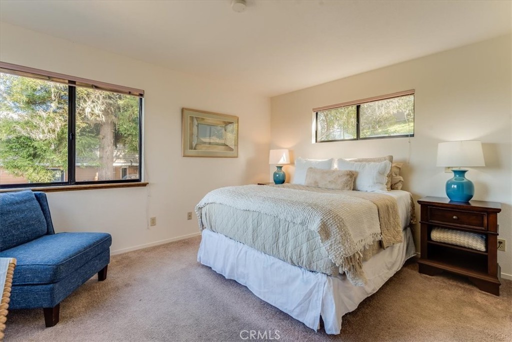 3171 Rogers Road Cambria, CA 93428 - Photo 46 of 73 a bedroom with a bed couch and window