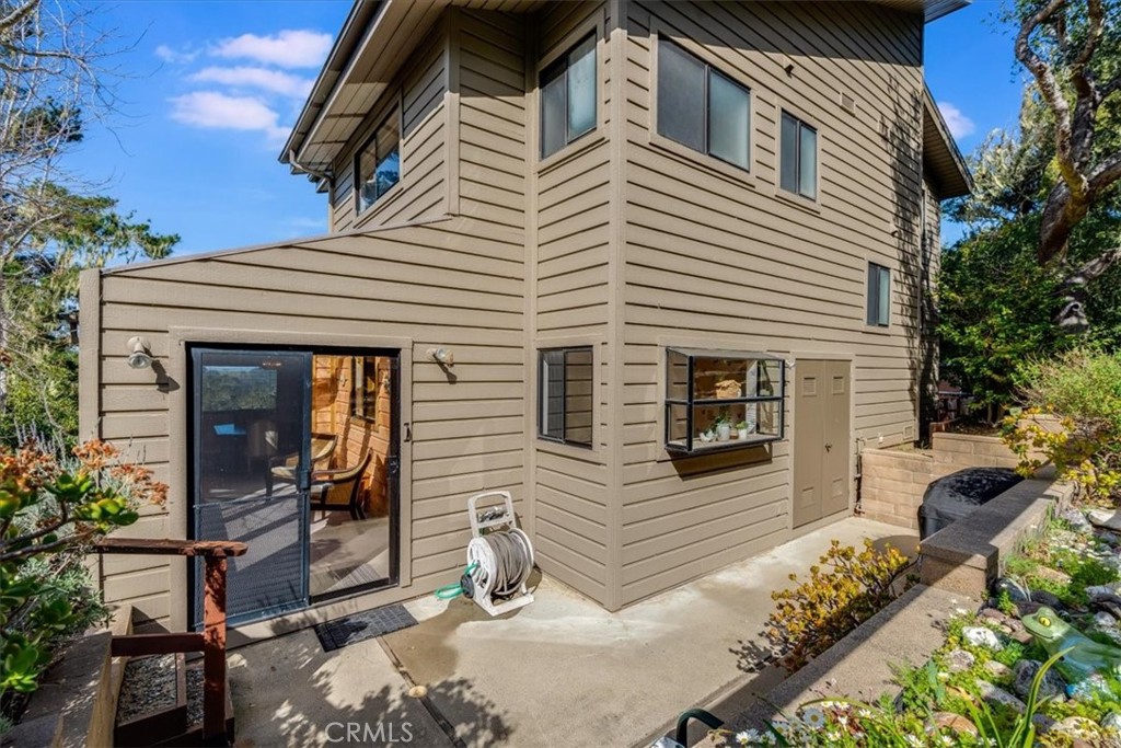 3171 Rogers Road Cambria, CA 93428 - Photo 54 of 73 a view of a house with backyard and sitting area