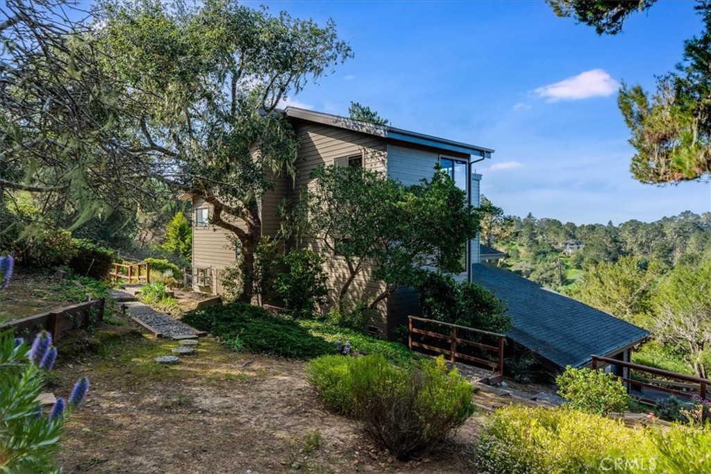 3171 Rogers Road Cambria, CA 93428 - Photo 56 of 73 a backyard of a house with lots of green space