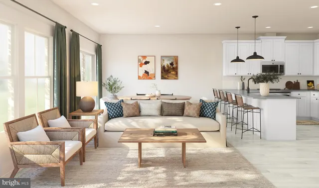 a living room with furniture a large window and a table