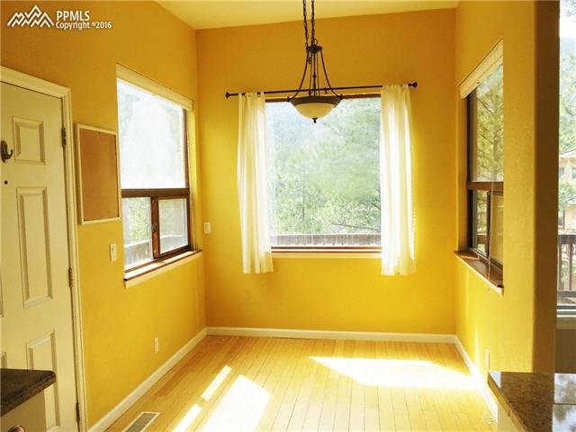 4320 Outpost Road Cascade, CO 80809 - Photo 1 of 6 Dining area off kitchen with mountain views!