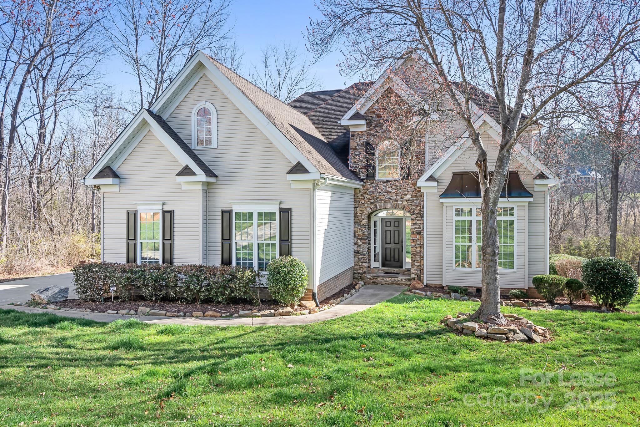 7277 Willowbrook Drive Denver, NC 28037 - Photo 1 of 33 a front view of a house with a yard and porch
