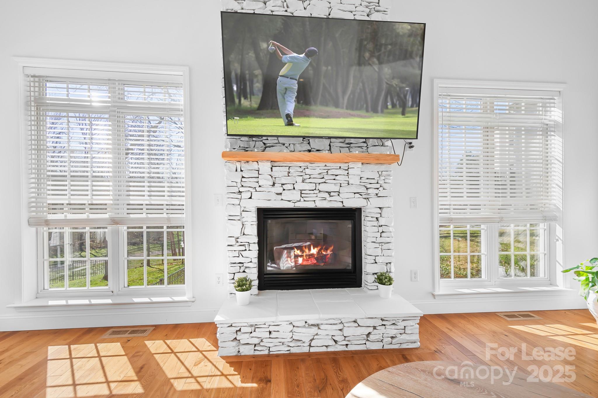 7277 Willowbrook Drive Denver, NC 28037 - Photo 11 of 33 a living room with a fireplace and a window