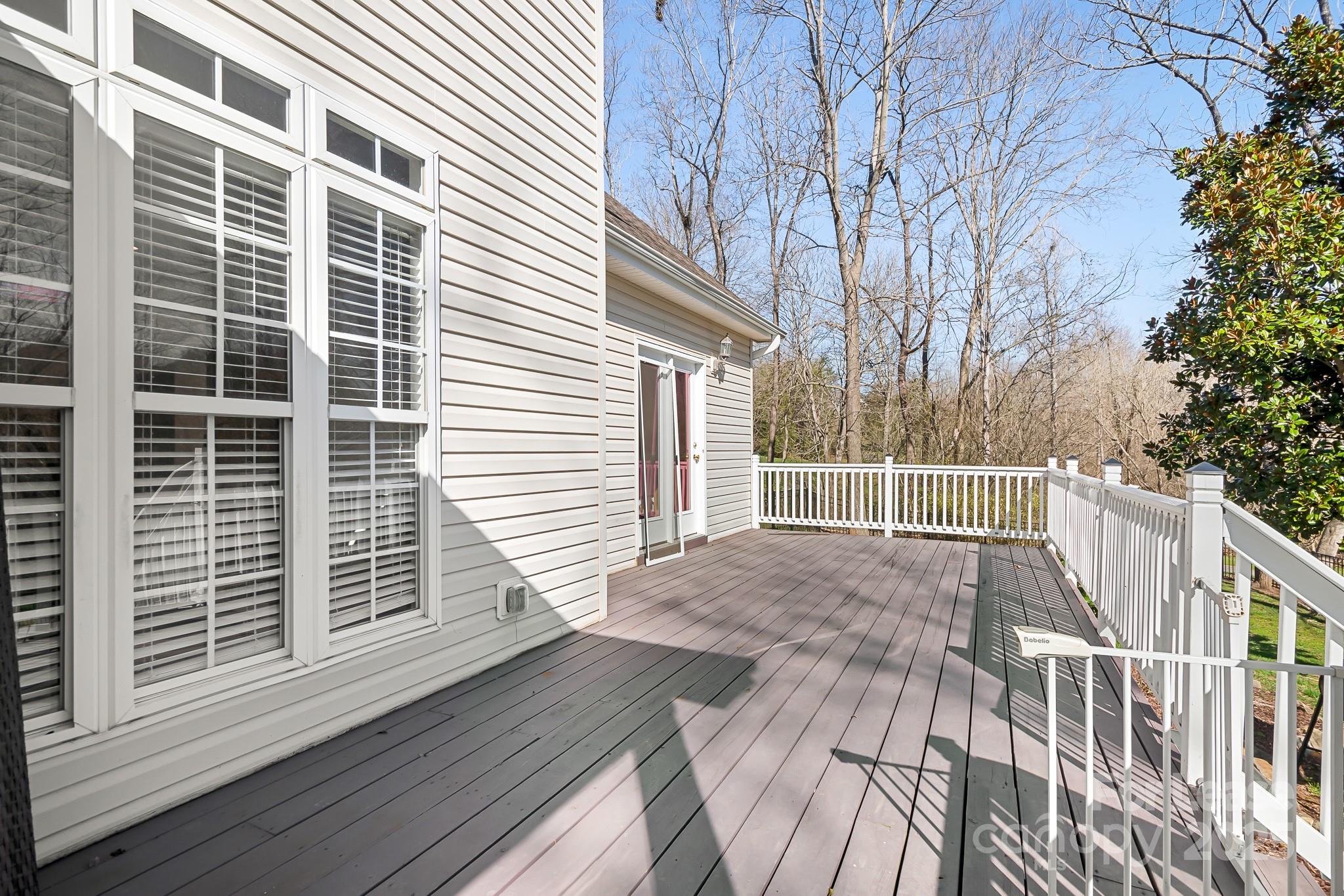 7277 Willowbrook Drive Denver, NC 28037 - Photo 17 of 33 a view of backyard with deck and wooden floor