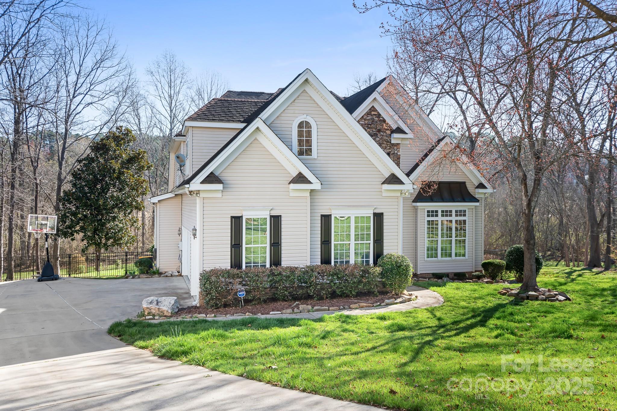 7277 Willowbrook Drive Denver, NC 28037 - Photo 2 of 33 a front view of a house with a yard